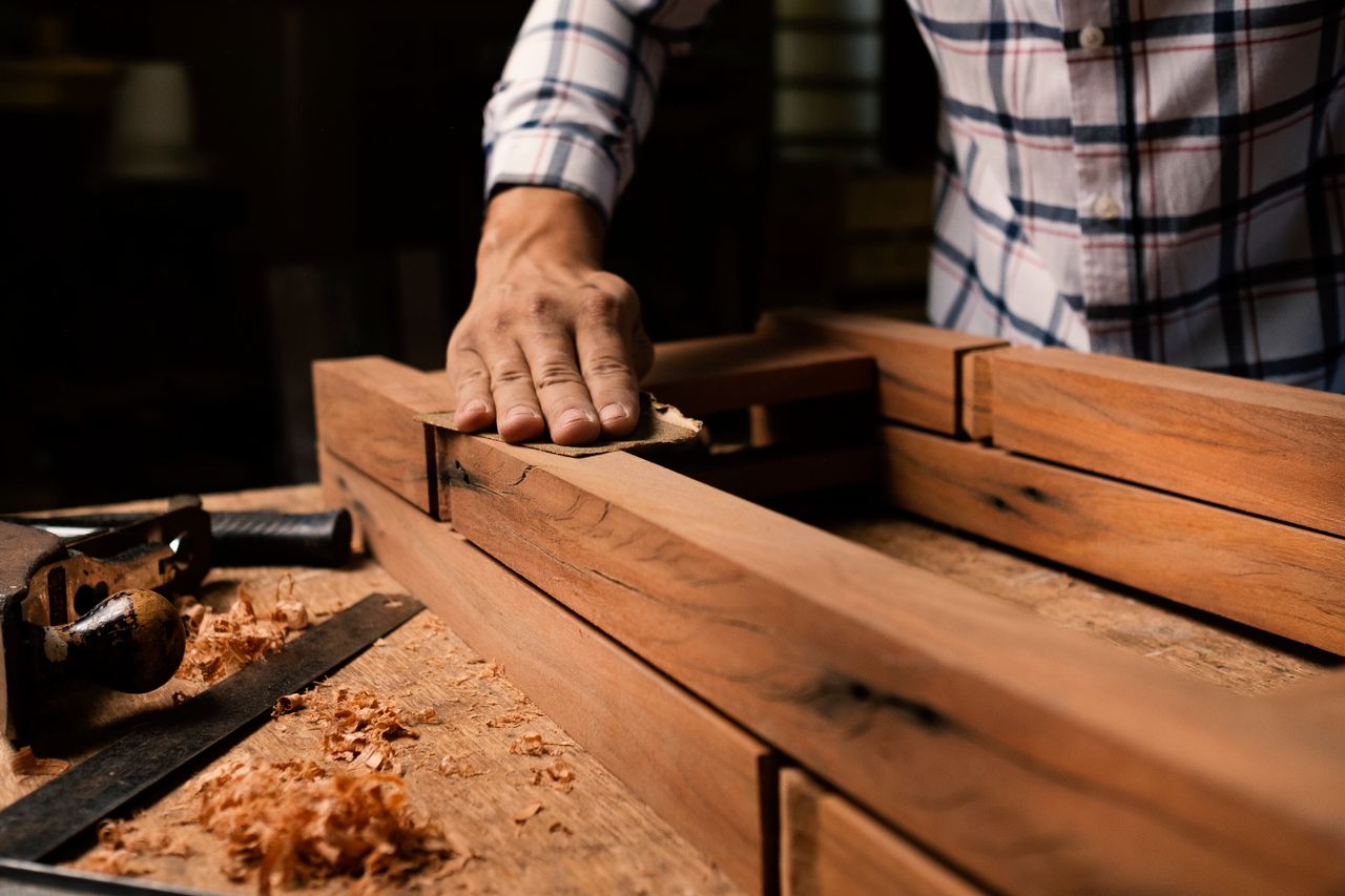 Woodworker using traditional joinery techniques